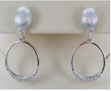 Load image into Gallery viewer, 14k White Gold  Oval Dangle Earrings With Diamonds - from Holsten Jewelers
